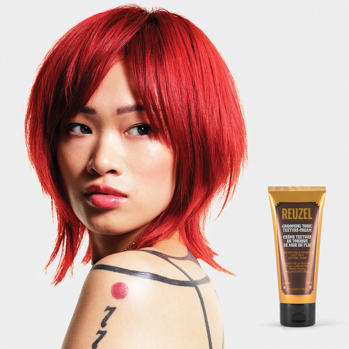 Reuzel Grooming Tonic Texture Cream in a jar, showing the creamy hair styling product with a textured finish.