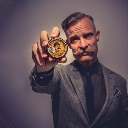 Reuzel Mustache Wax Bourbon Sidecar for beard styling, with a small tin of beard wax and a bourbon-themed label.