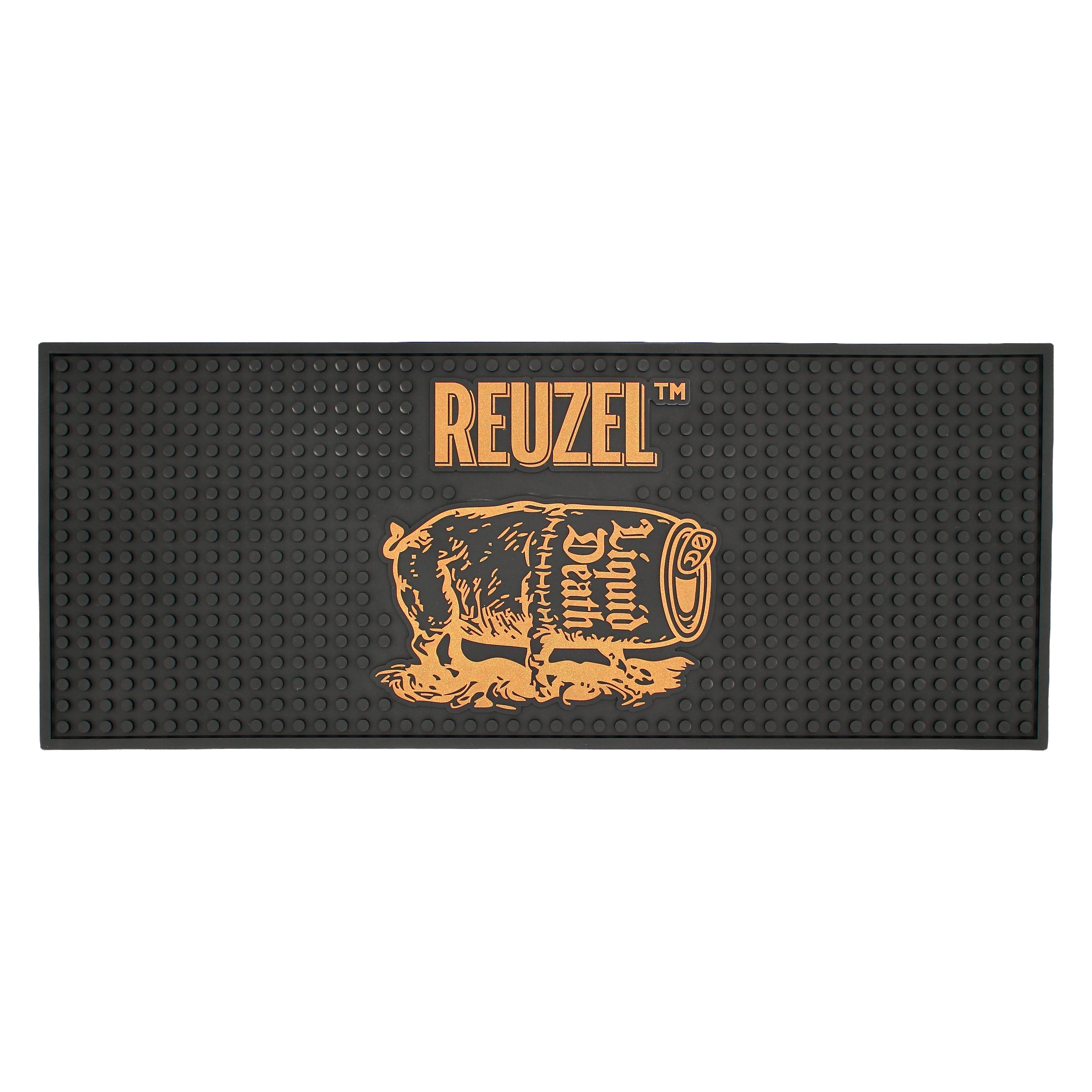 Reuzel Liquid Death Barber Mat featuring a graphic severed head design, made for barbers to protect workspaces.