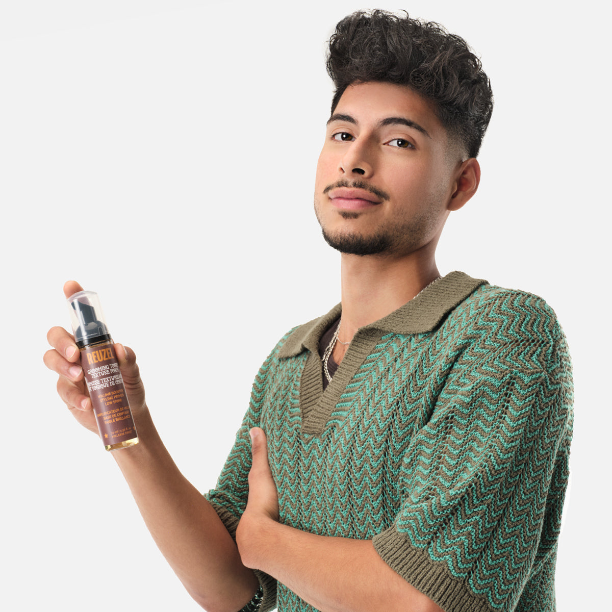 Reuzel Grooming Tonic Texture Foam in a bottle, hair styling product for adding volume and texture to hair.