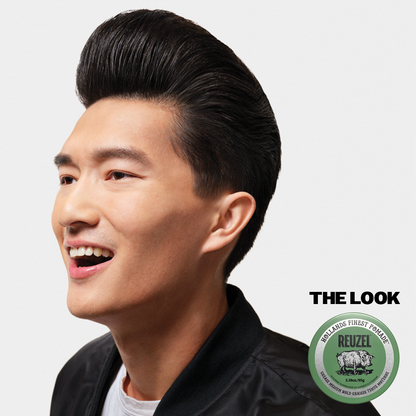 Green Reuzel Pomade grease jar with label, creamy hair styling product for men’s classic, slicked-back hairstyles.