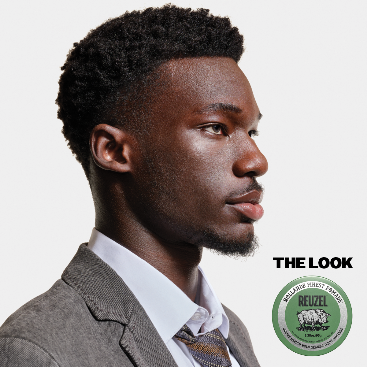 Reuzel Green Pomade grease jar with green lid and label, showing the styling product for hair grooming in a clear container.