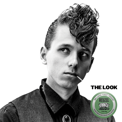 Green Reuzel Pomade grease jar with a white lid, showcasing the thick, green styling product for classic hair grooming.