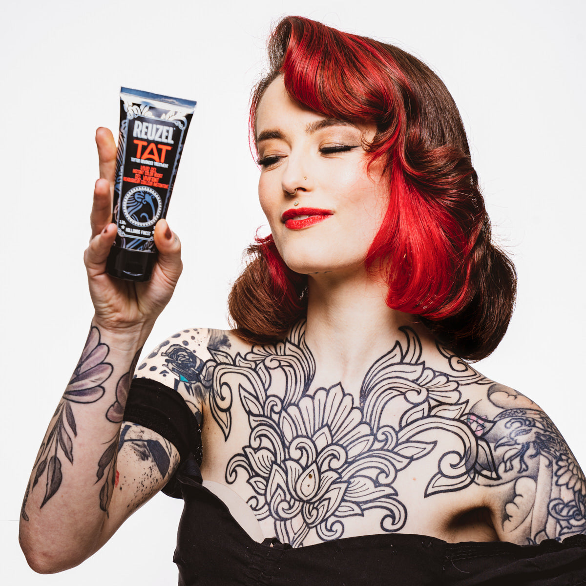 Reuzel TAT Vivid Gel tattoo aftercare product in a clear container with a white lid, designed for tattoo healing and hydration.